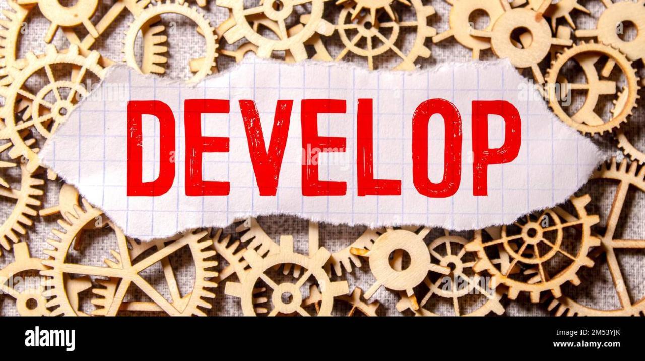 Develop word written on wood block. Develop text on cement table for ... Develop word written on wood block. Develop text on cement table for ...